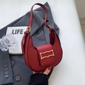 Chic red crescent underarm bag in matte leather finish with elegant gold buckle detail - Red