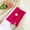 Fuchsia crocodile embossed envelope clutch bag with a round gold metal buckle closure - Rose Pink