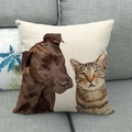 Linen cushion cover featuring realistic dog and cat prints on a gray fabric sofa - Brown Dog and Tabby Cat