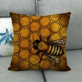 Linen pillowcase with honeybee and honeycomb pattern on a gray fabric sofa - Orange Golden Honeycomb Bee (10) / 18x18 Inch