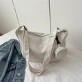 Retro cream corduroy shoulder bag with textured stripes and a small round coin purse - White