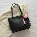 Black large tote bag with quilted diamond pattern and a pink peach charm detail - With Pendant Style / Black