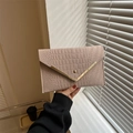 Chic pale pink envelope clutch bag featuring crocodile texture and V-shaped metal trim - Khaki