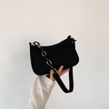 Chic black underarm baguette bag with textured fabric, metal chain and shoulder strap - Black