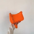 Minimalist bright orange baguette crossbody bag with chunky acrylic chain and stone texture - Orange
