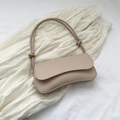 Chic apricot shoulder bag with golden text detail and elegant decorative knot strap - Khaki