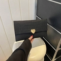 Chic black crocodile embossed envelope clutch bag with a golden heart clasp detail - Black