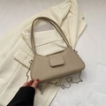 Beige faux leather shoulder bag with silver chain on minimalist neutral clothing - Khaki