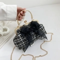 Tweed shell bag in black and white with a mesh bow and elegant pearl accents - Black