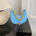 Light blue faux leather crescent bag with snakeskin texture and gold chain strap - Blue
