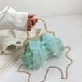 Mint green woven shell bag featuring a light blue tulle bow and pearl accents with chain - Green