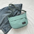 Minimalist mint green crossbody tote bag in nylon material with adjustable strap - Green