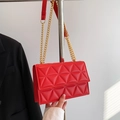 Quilted red crossbody bag with elegant gold chain strap and luxury diamond stitching - Red