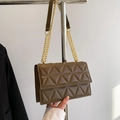 Deep brown quilted crossbody bag with triangle geometric stitching and gold chain strap - Brown