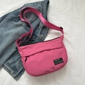 Minimalist bright pink crossbody bag with adjustable strap on denim background - Rose Pink