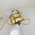 Golden crocodile embossed handbag with crossbody strap and tassel detail for women - Gold