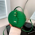 Green round crocodile pattern handbag with gold hardware and stylish cross body strap - Green