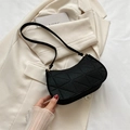 Minimalist black quilted underarm bag with gold metal hardware and diamond stitching - Black
