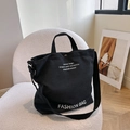 Versatile borsa tote in tela nera con tracolla regolabile e bottone automatico retrò - Nero