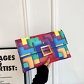Minimalist envelope clutch bag featuring colorful geometric mosaic and gold square buckle - Colorful