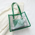 Translucent PVC tote bag with green leather trim and vibrant multi-colored rivets - Green