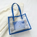 Blue transparent tote bag with colorful gemstones and inner pouch on white fabric - Blue