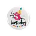 Detail of a 3rd birthday tinplate badge with a party hat and colorful flags decoration - 3rd Birthday