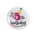 Close-up of a white 5th birthday tinplate badge with colorful party decorations - 5th Birthday