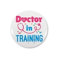 Macro detail of 'Doctor in TRAINING' tinplate badge with colorful medical icons - Doctor In Training (Style 11)
