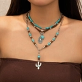 Dettaglio di collana boho a strati con perline turchesi e ciondolo a forma di cactus - Stile 3 Strati Cordino Scamosciato Goccia Cactus Turchese