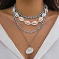 Detail view of a 4-layer ocean style necklace with blue beads and seashell pendants - Silver (234439)