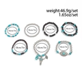 Dettaglio set 7 braccialetti bohémien con perline di turchese, legno e ciondoli in metallo - Multicolore (06776)