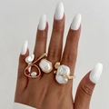Golden liquid metal ring set with baroque imitation pearls on elegant model hands - Baroque Multi-Pearl Style (06770)