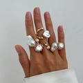 Detailed view of Baroque irregular pearl rings in gold finish worn by model - Modern Irregular Pearl Style (06784)