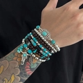 Set di 7 braccialetti da uomo bohémien con perline turchesi, legno e ciondoli etnici - Stile Testa di Toro e Foglia in Perlina di Legno (06776)