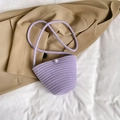 Minimalist lavender woven bucket bag with elegant pearl button detail and braided strap - Purple