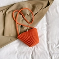 Mini orange woven straw crossbody bag with pearl bead button and long cotton rope strap - Orange