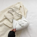 Minimalist white pleated leather underarm bag with rectangular buckle on suit background - White