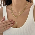 Gold layered necklace with star pendants and OT buckle closure on female model - Necklace Gold (4771)