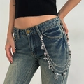 Y2K punk style multi-layer silver waist chain with star charms and faux pearls on denim - Black Bead Star Style (01992)