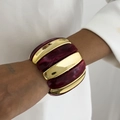 Macro shot of wide beaded bracelet with golden metal and marble resin segments - Dark Red (0124)