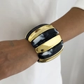 Detail of wide stretch bracelet with gold metal and black marble resin segments - Black (0124)