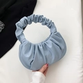 Light blue pleated crescent handbag with soft ruched handle and faux leather finish - Sky Blue