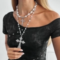 Double-layer faux pearl necklace with rhinestone cross pendants on a female model - Silver Double Layer Pearl Cross Style (06839)