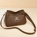 Minimalist coffee brown bucket bag with kangaroo logo and adjustable strap - Brown