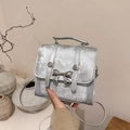 Elegant silver bow handbag for women with metallic texture and versatile shoulder strap - Silver