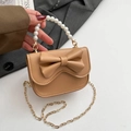 Mini khaki crossbody bag featuring a large decorative bow and a white pearl handle strap - Brown