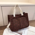 Detailed texture of brown corduroy tote with red strawberry print and front pockets - Strawberry Coffee