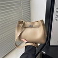 Elegant beige leather handbag with classic metal twist lock and adjustable shoulder strap - Khaki