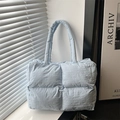 Quilted light blue puffer tote bag with soft down padding and wide shoulder strap - Blue